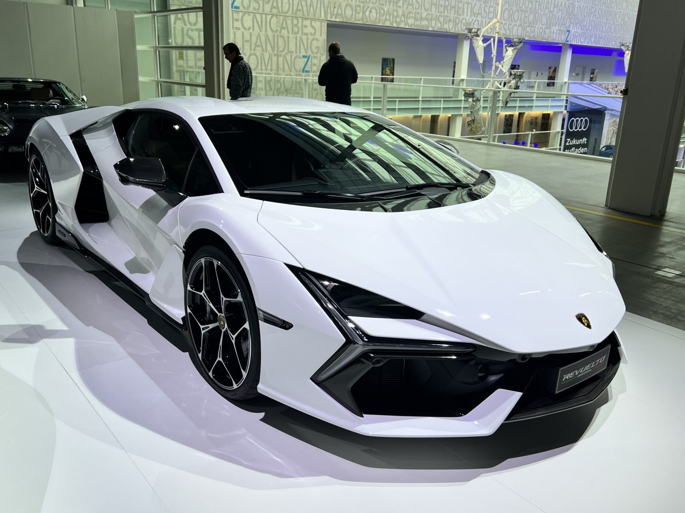 Sharp angular front and side design of a white high-performance sports car