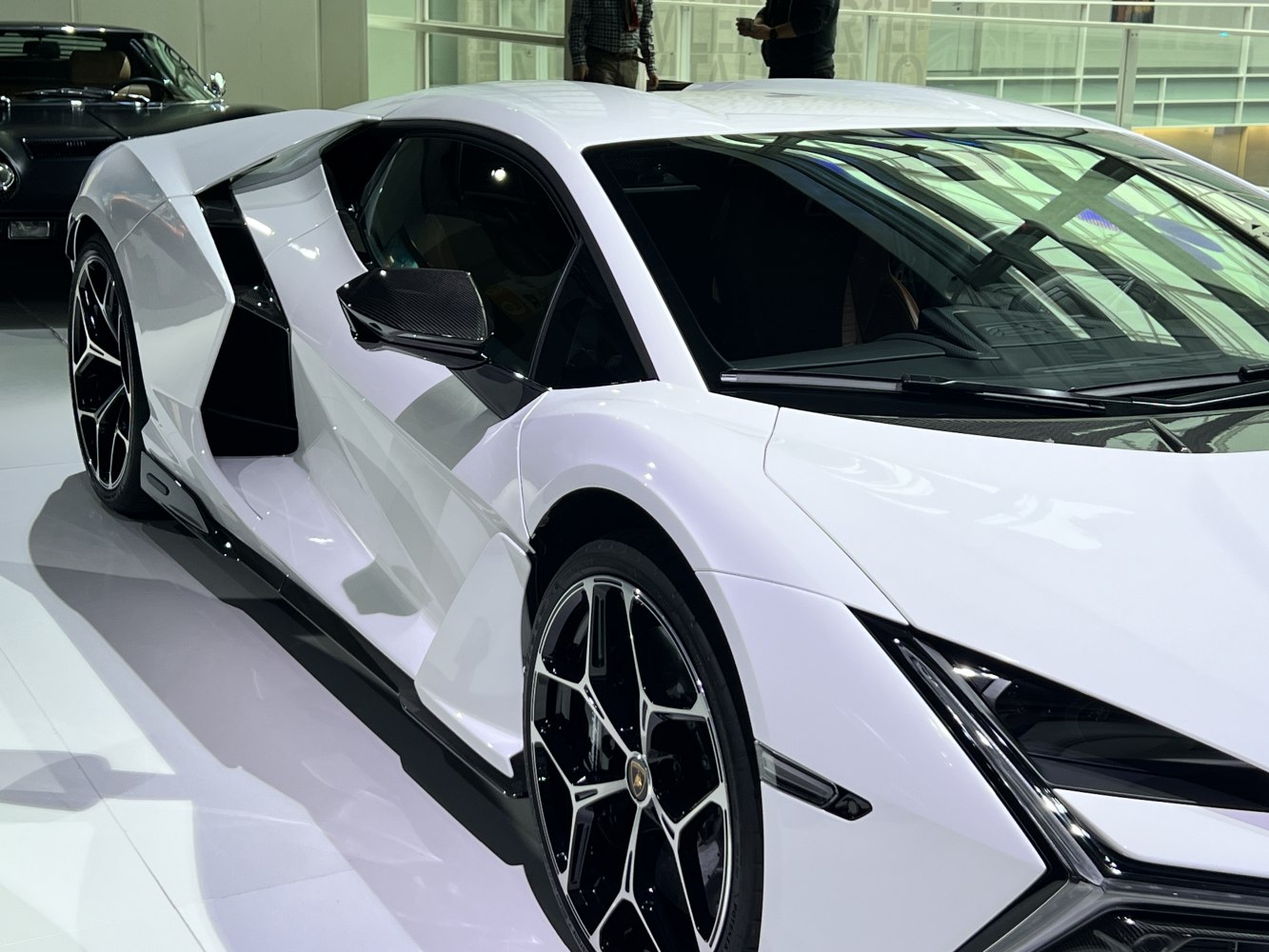 Sleek side profile with aggressive front design and geometric aerodynamic features