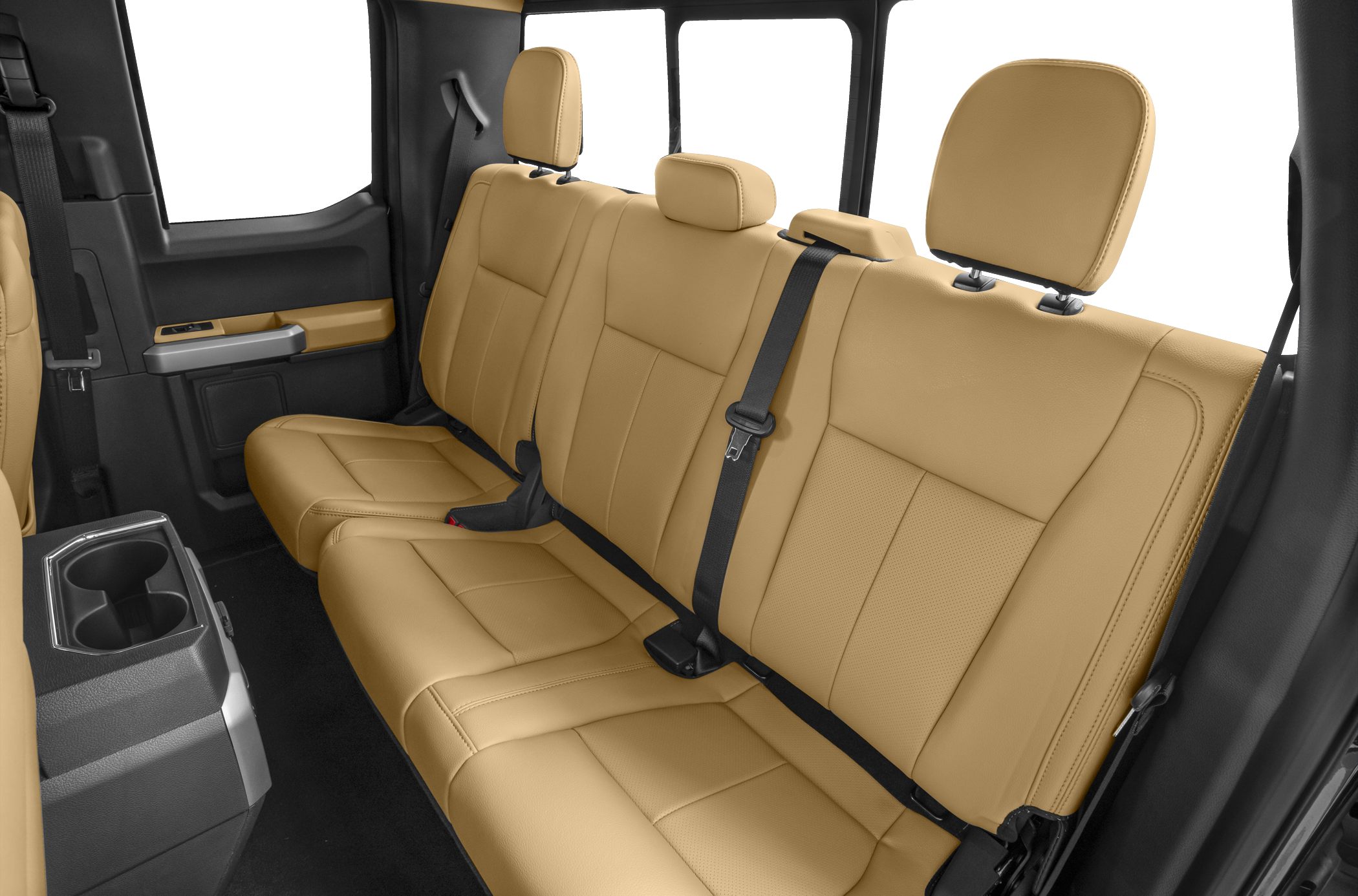 Tan leather rear bench seat with headrests and seatbelts inside vehicle cabin