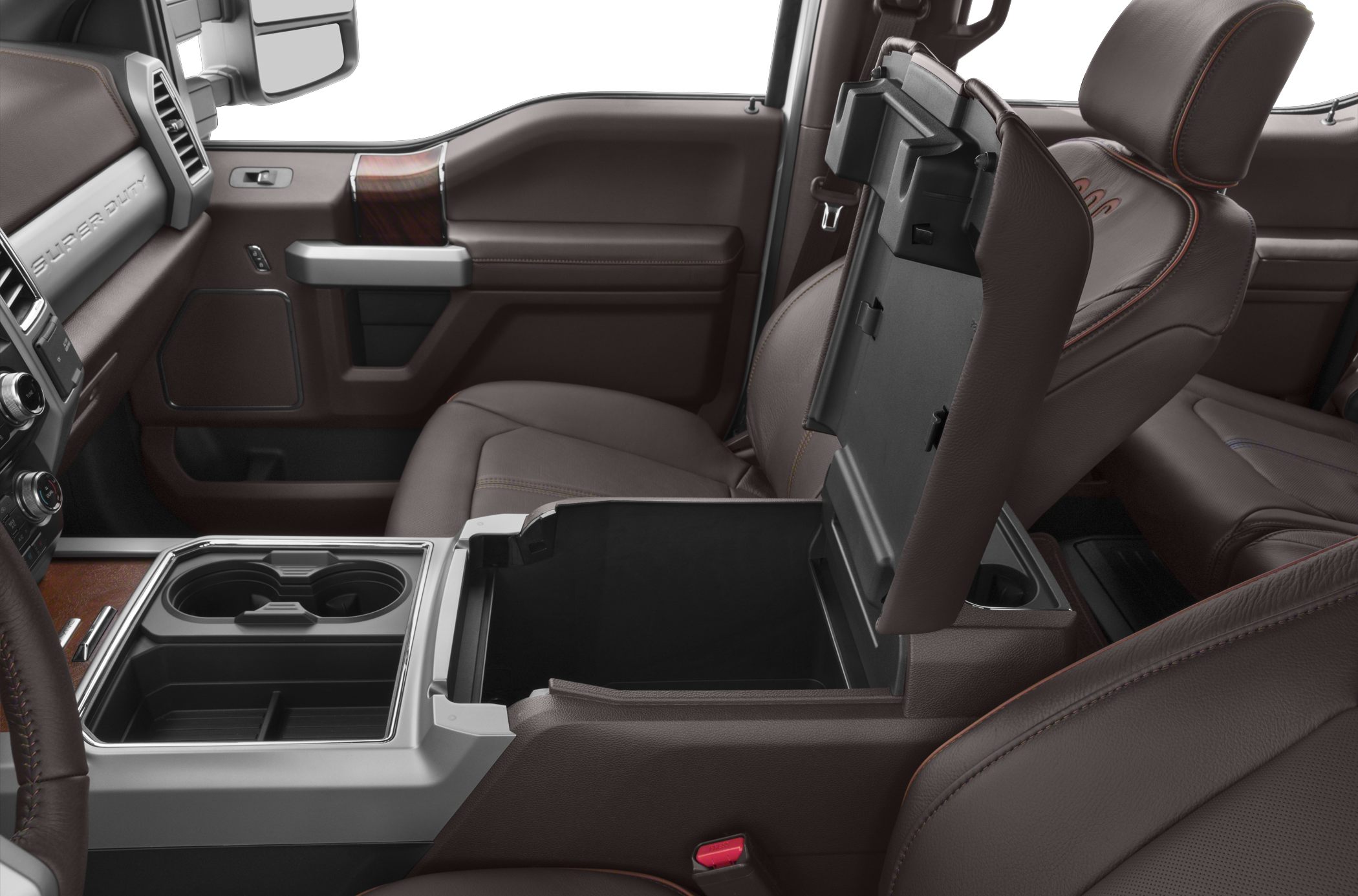 Spacious center console with open storage and cup holders in brown leather interior