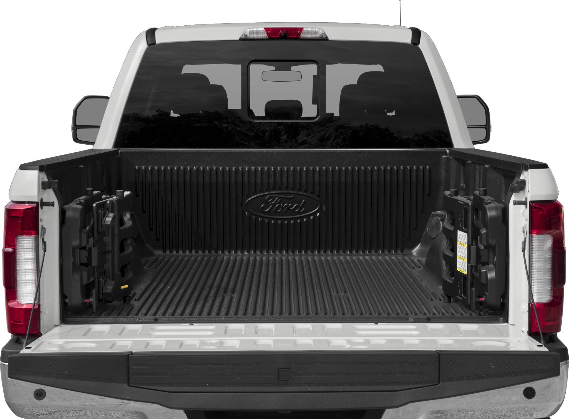 Open truck bed with protective liner and folded accessories inside
