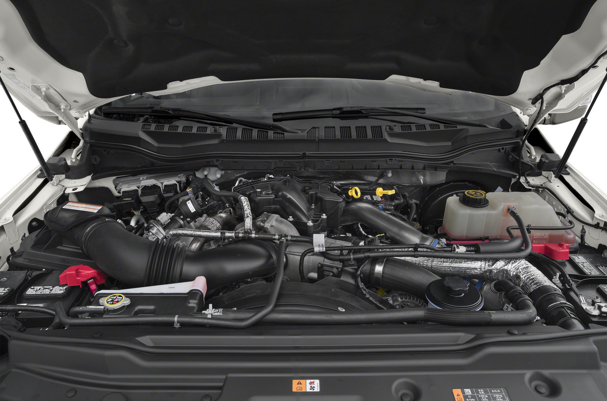 Heavy-duty engine compartment with visible components and hoses