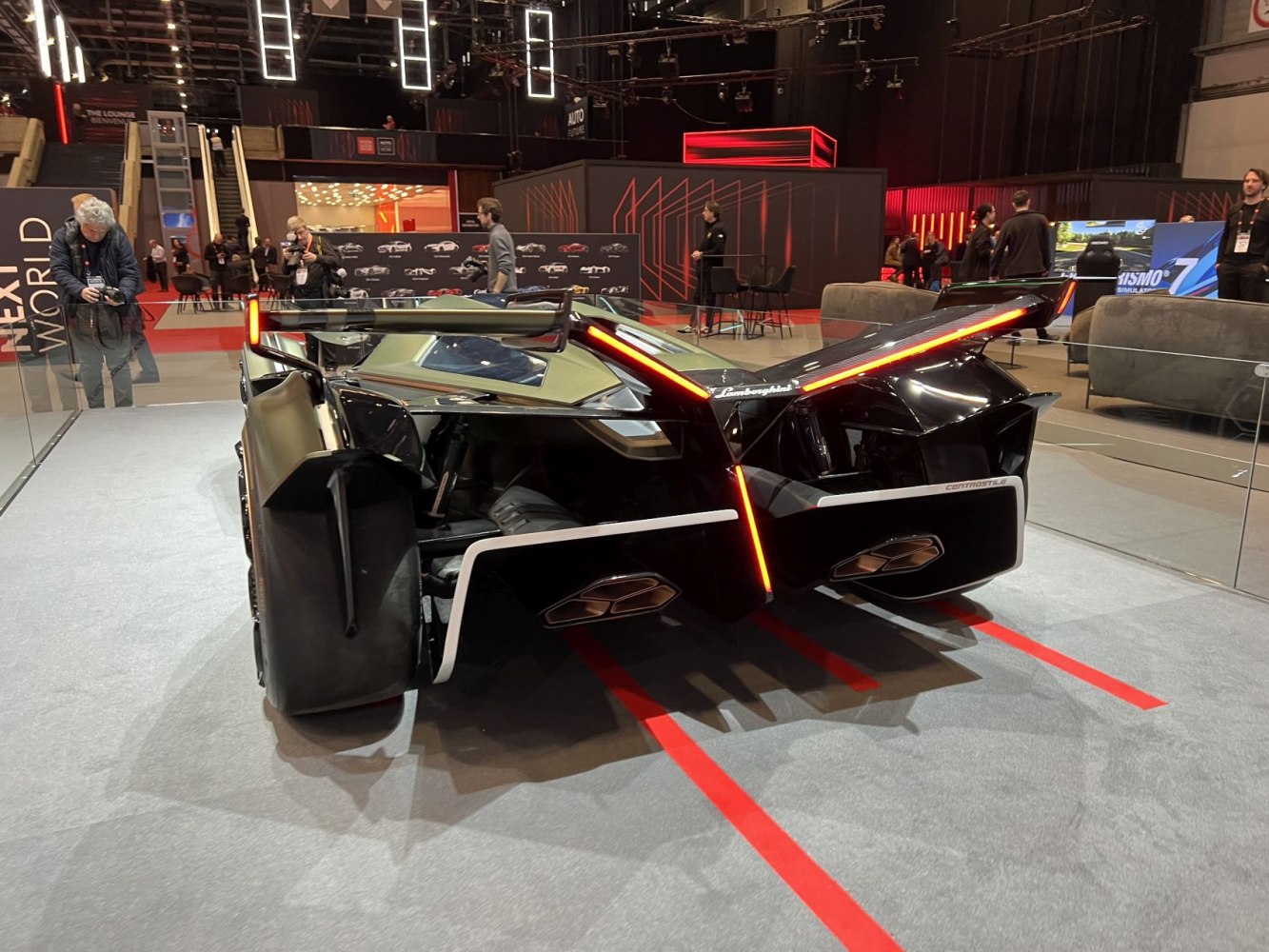 Futuristic rear with LED taillights, wide racing tires, and aerodynamic diffuser.