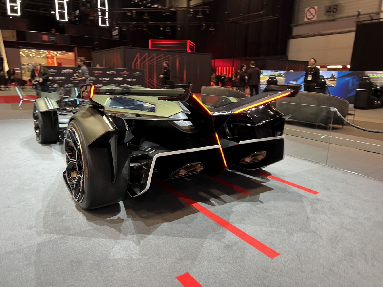 Rear aerodynamic design with V-shaped LED tail lights and wide racing tires
