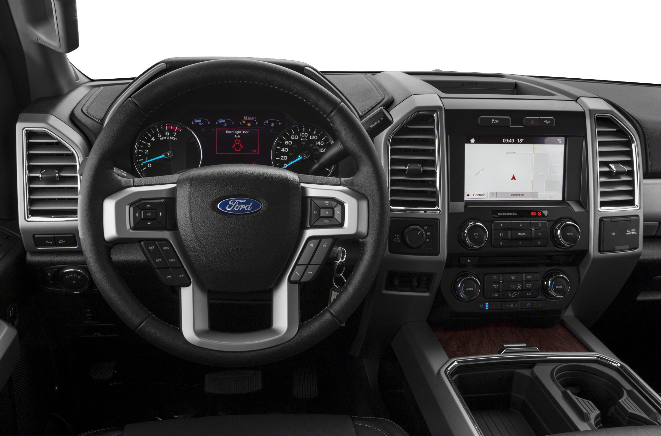 Ford truck steering wheel and dashboard with infotainment system.