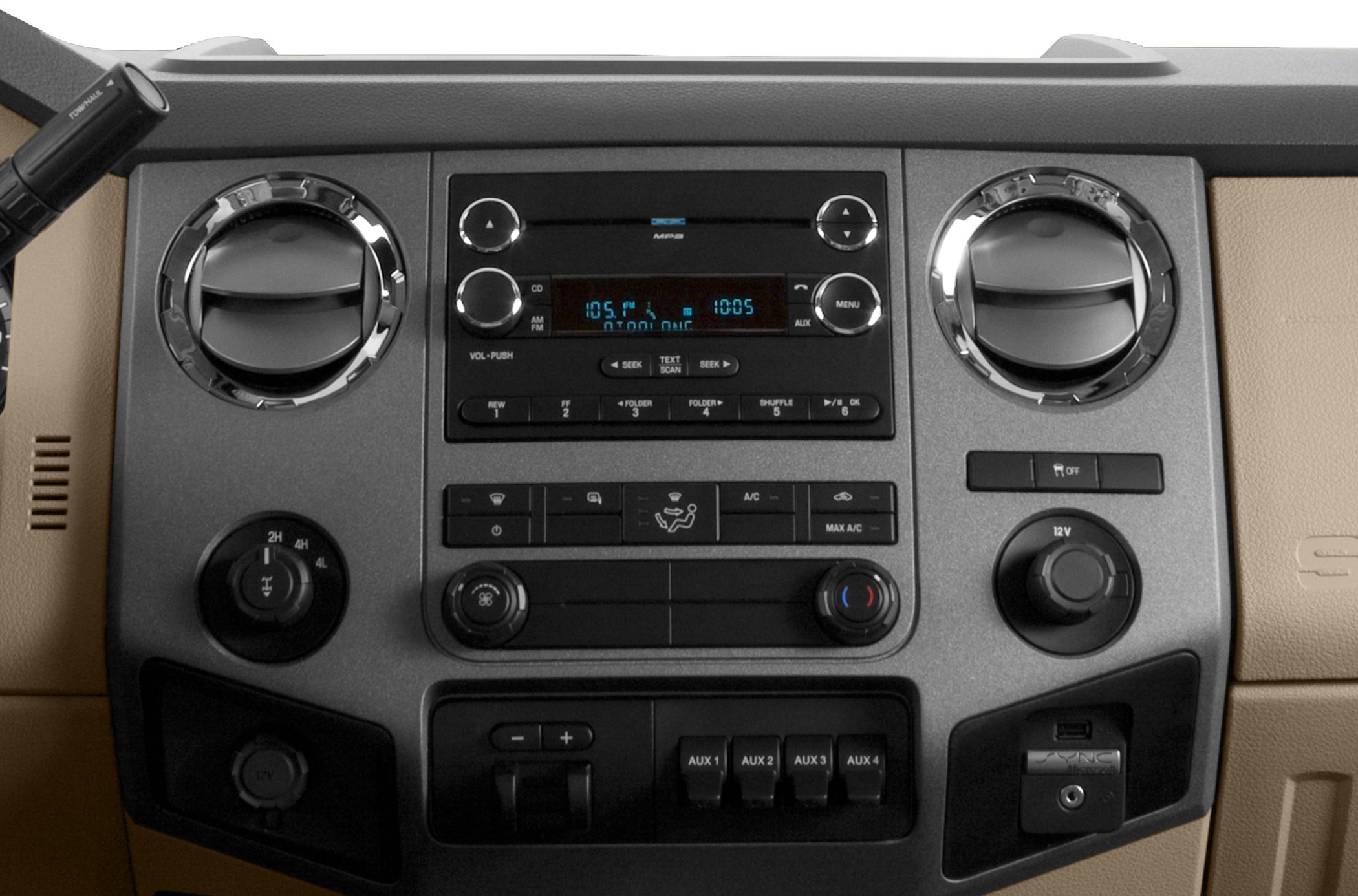 Dashboard controls and radio panel with vents, AUX switches, and climate control knobs