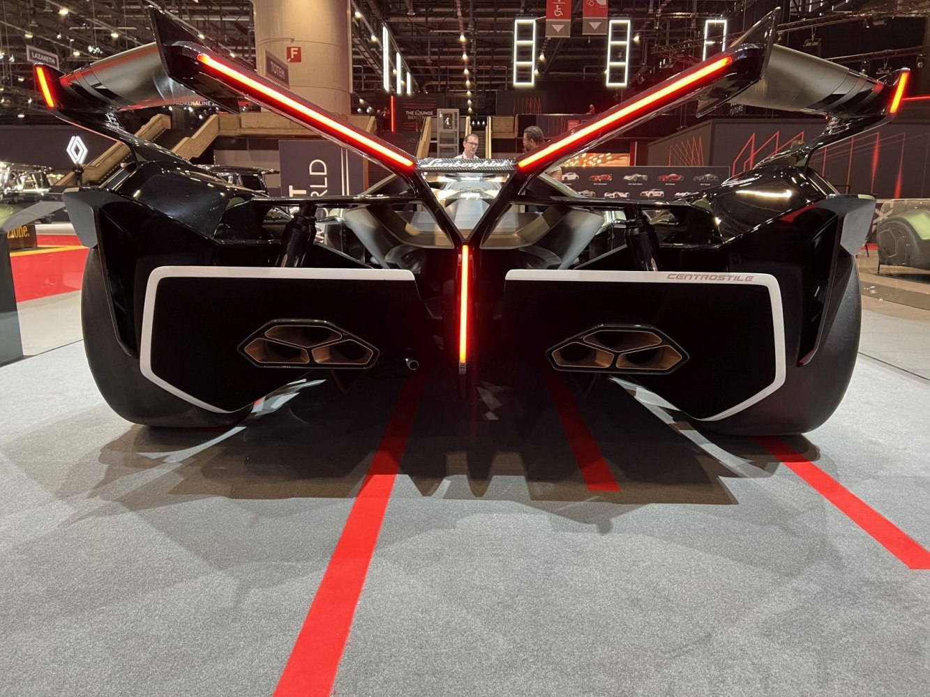 Dual angular exhausts with red LED aero lights and a rear diffuser