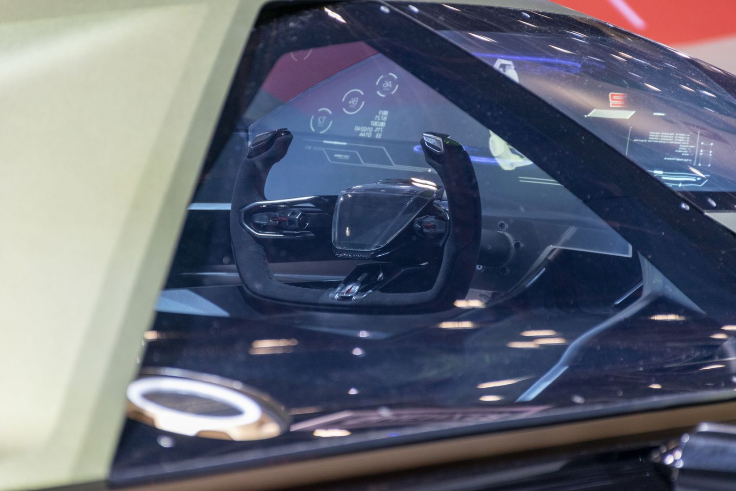 Futuristic racing-style steering wheel with digital display