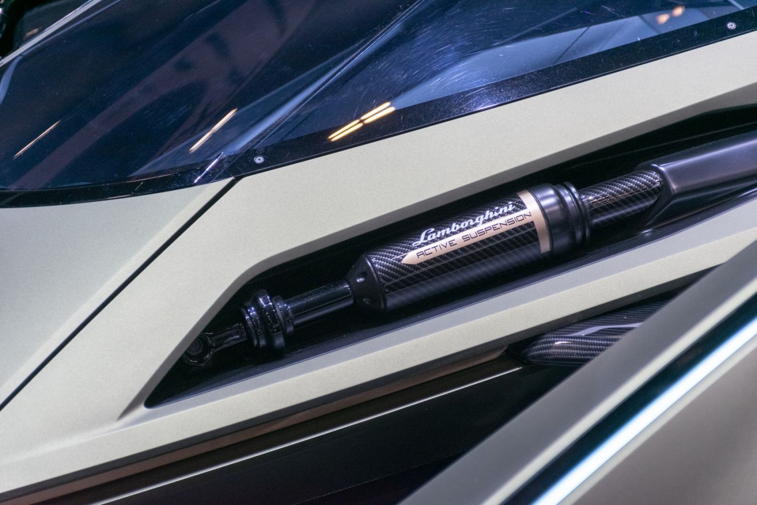 Close-up of Lamborghini active suspension with carbon fiber details
