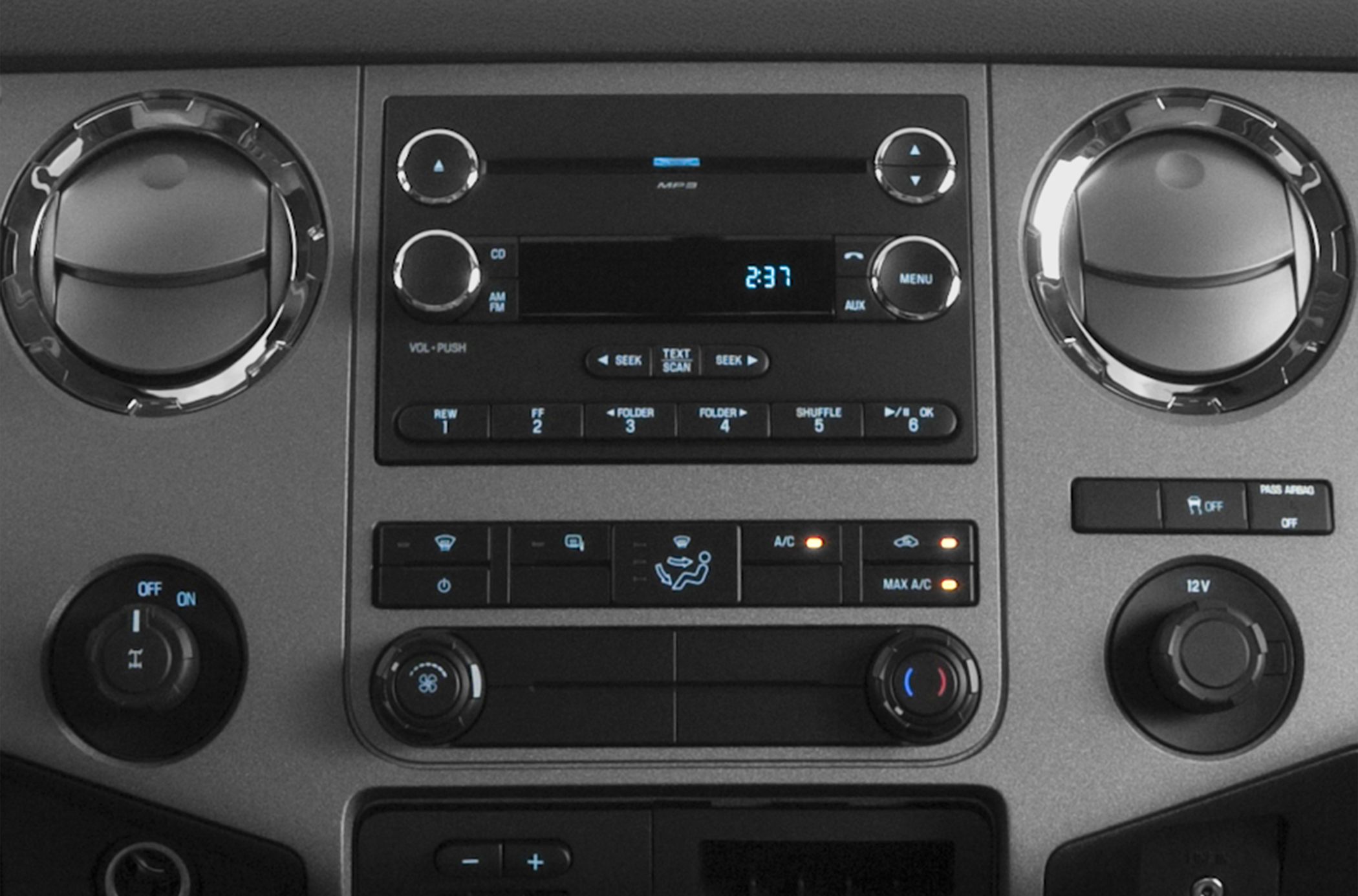 Audio and climate control panel with vents and knobs