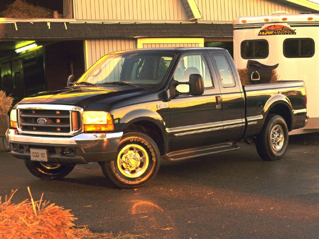 Black extended cab pickup truck with chrome details and front side visibility