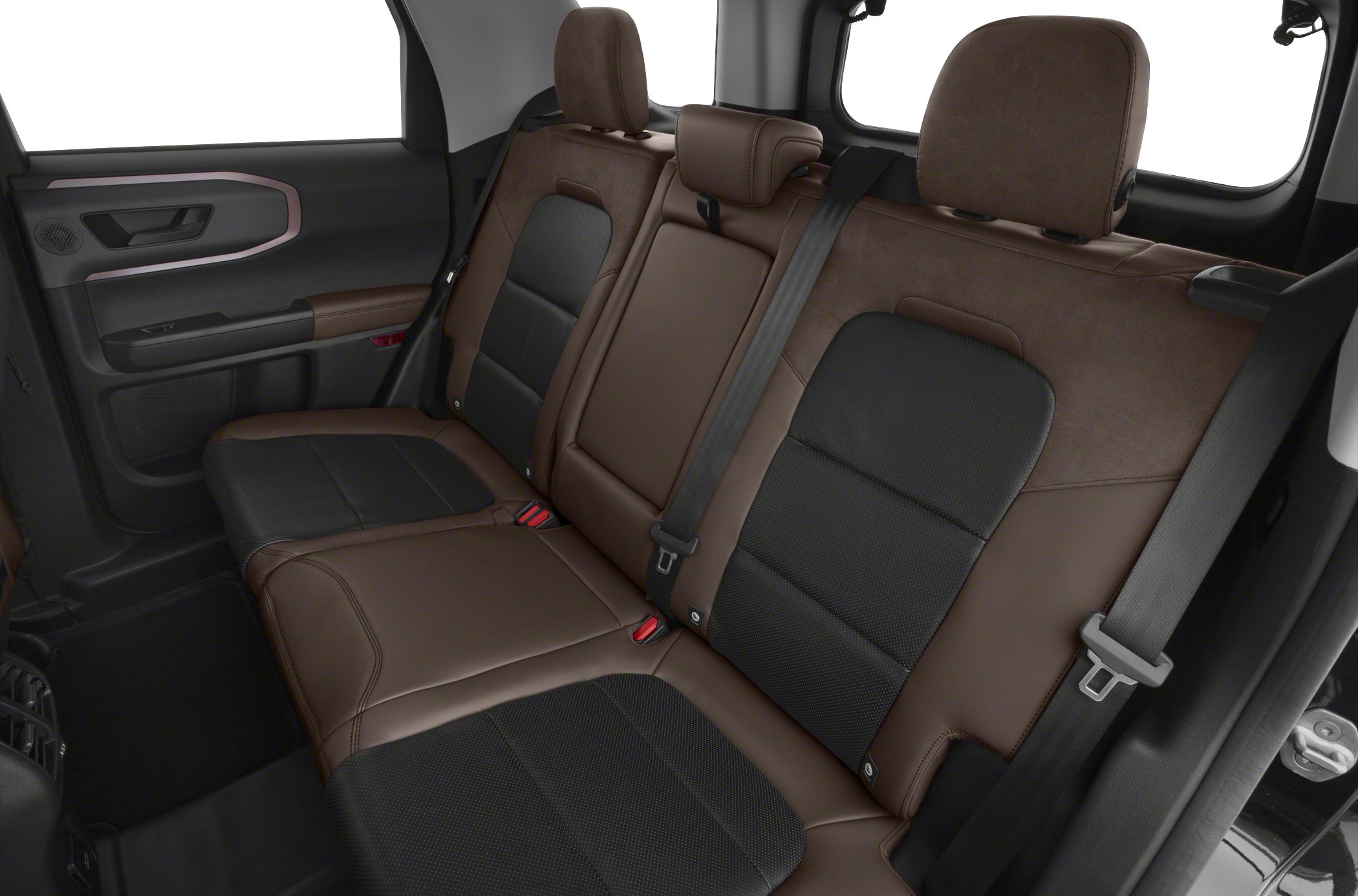 Rear seat interior with brown and black upholstery and seat belts