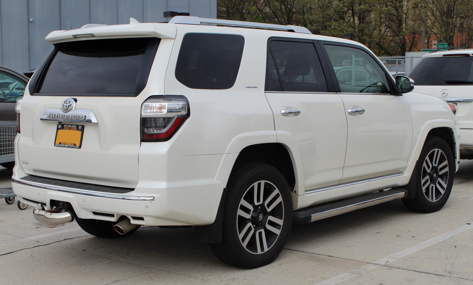Rear and side view of white SUV with LED taillights and alloy wheels