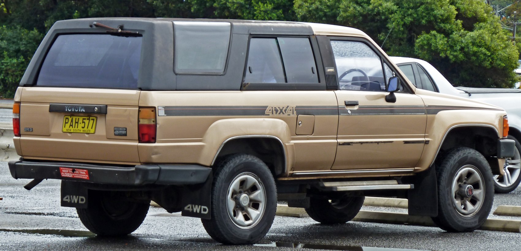 Vintage SUV with 4WD, elevated ride height, and off-road design.