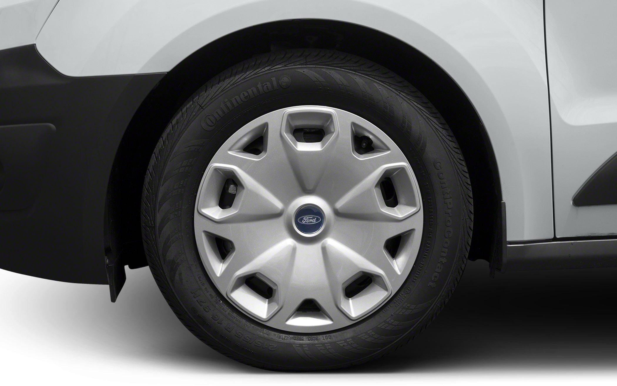 Close-up of wheel with Continental tire on white vehicle panel