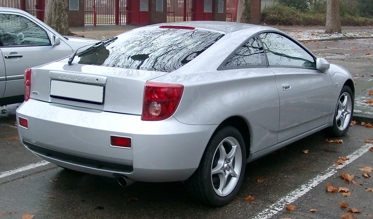 Rear sporty coupe with alloy wheels and spoiler