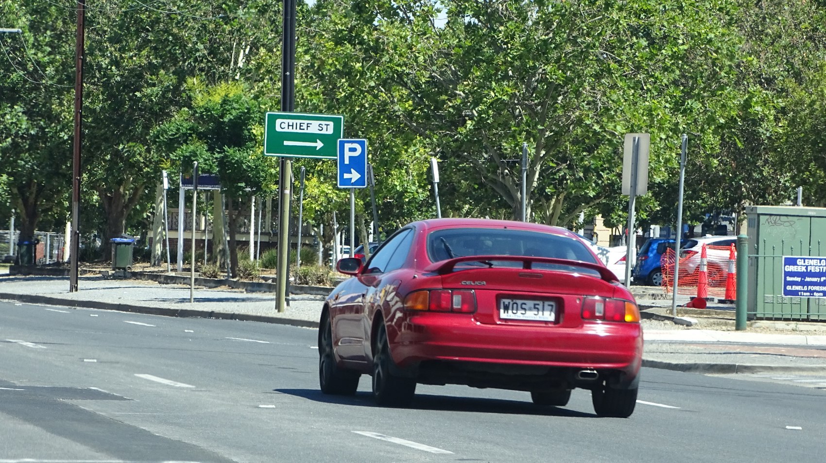 Red sport coupe with rear spoiler and distinct taillights