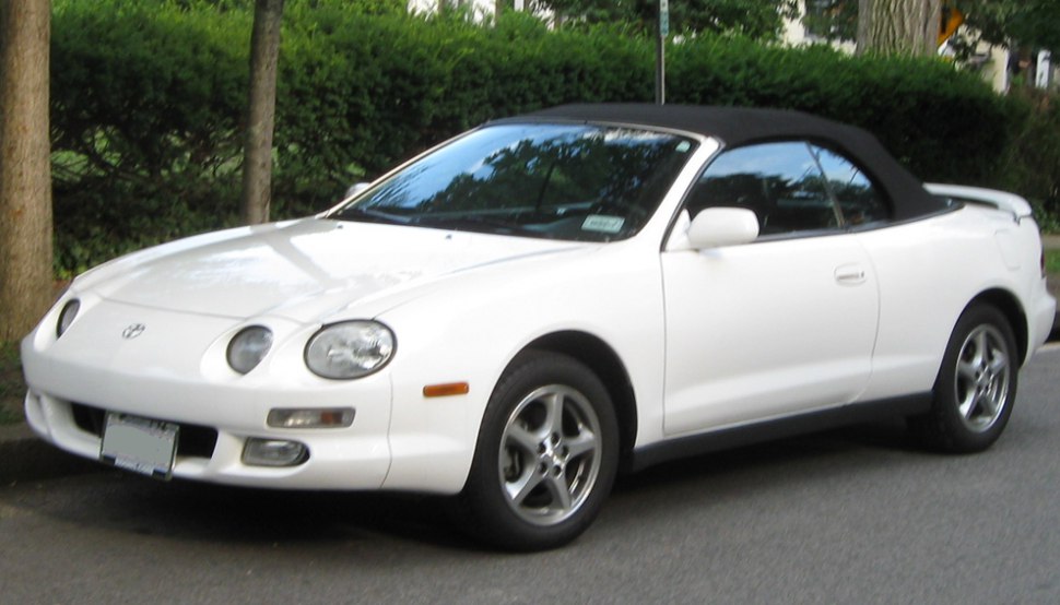 White sport cabriolet with black soft top