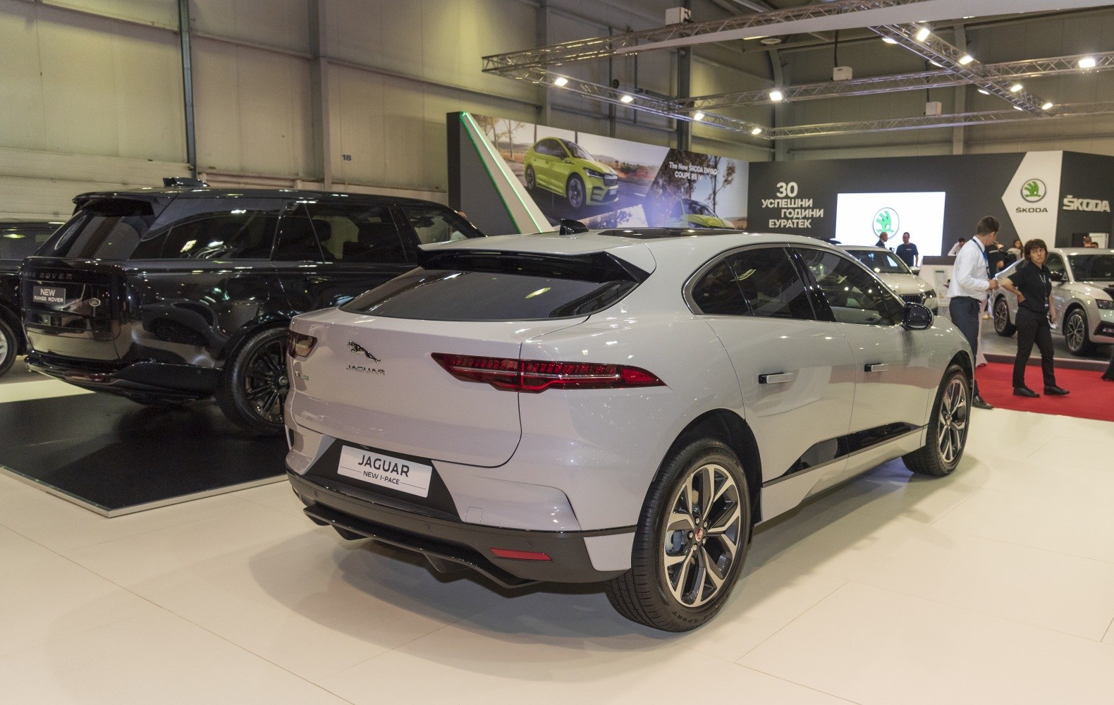 Rear and side view of sleek electric SUV with distinct taillights and alloy wheels