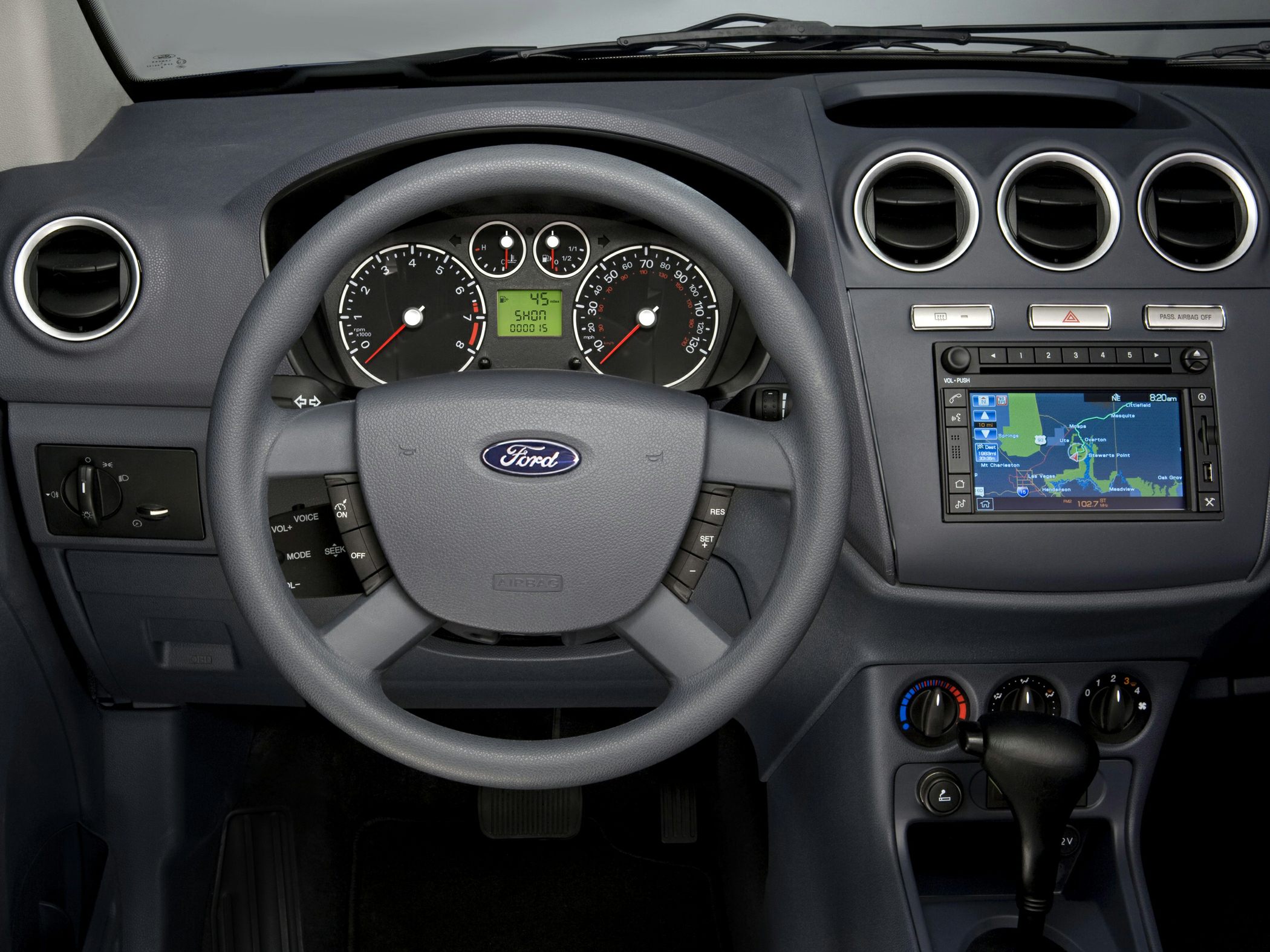 Steering wheel, instrument cluster, and central dashboard with navigation system