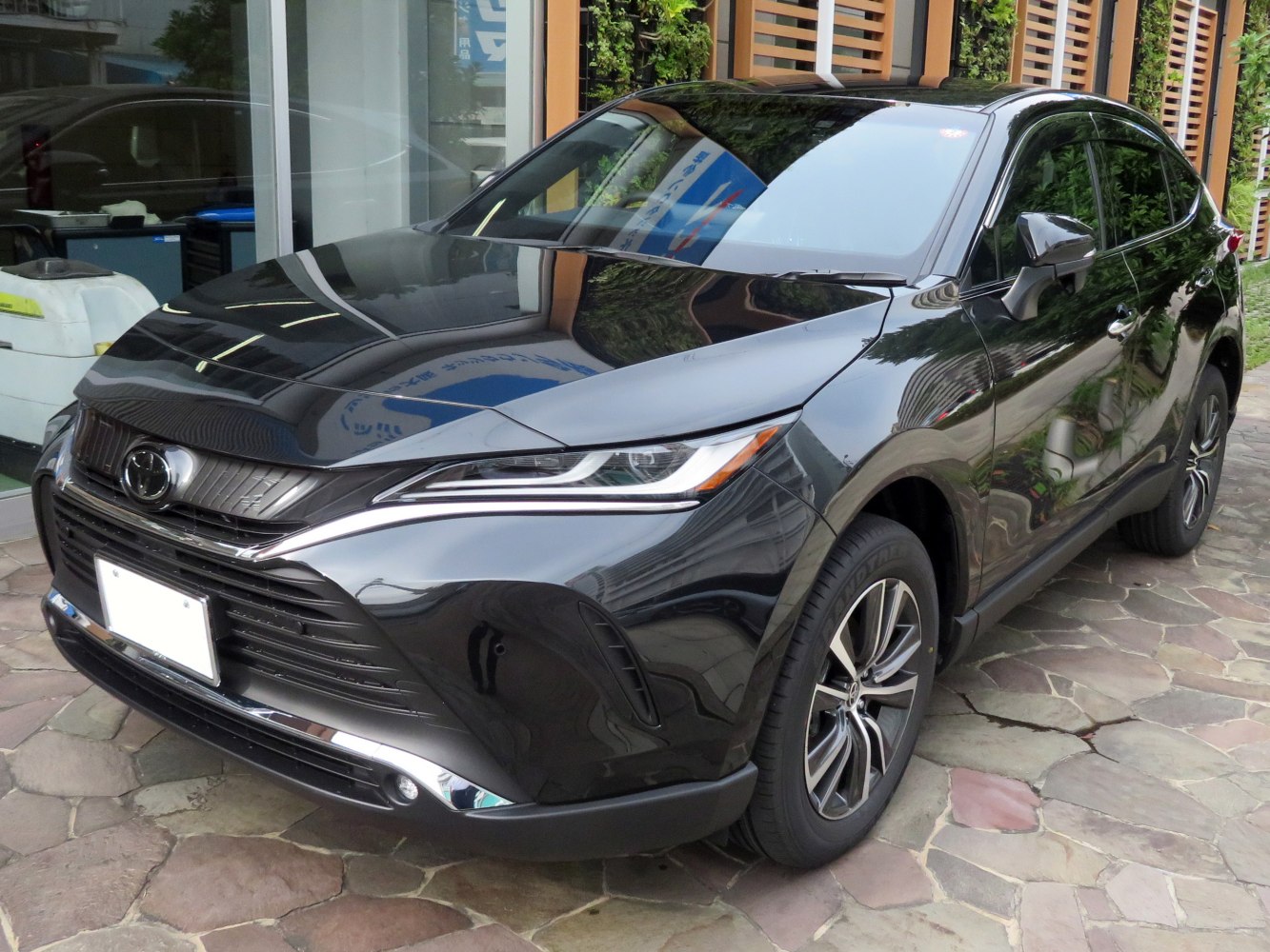 Front angle view of modern SUV with LED headlights and alloy wheels