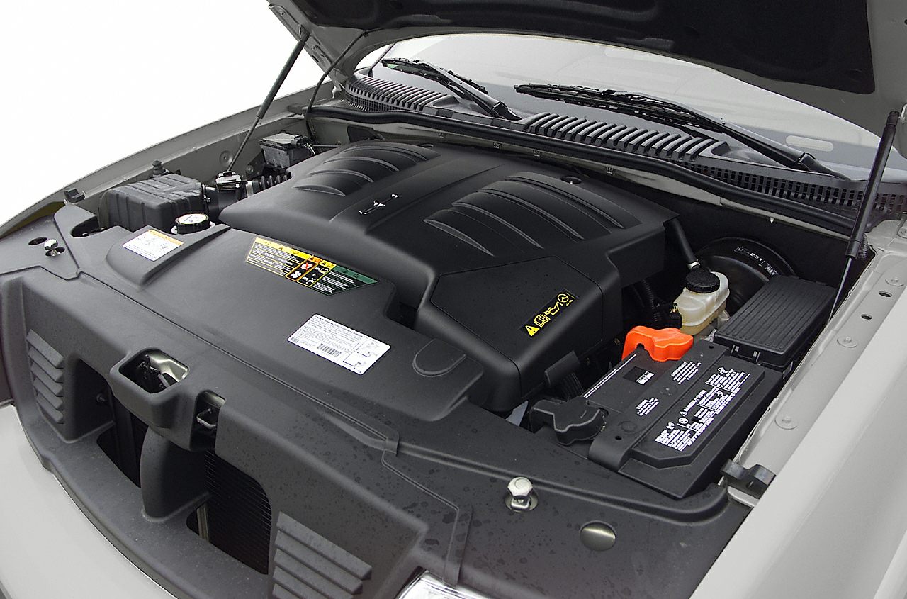 Engine bay close-up with prominent engine cover and battery layout