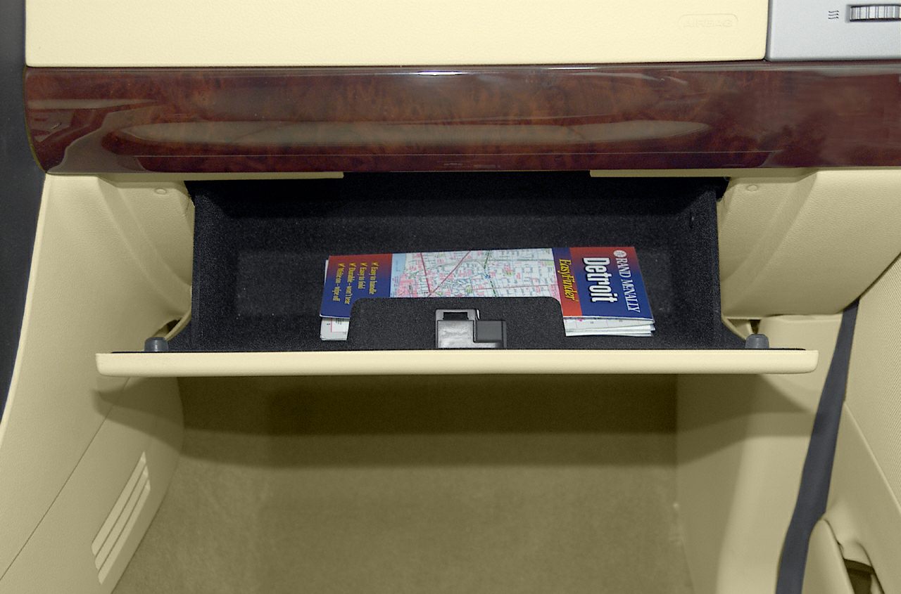 Glovebox with folded maps showcasing interior storage space