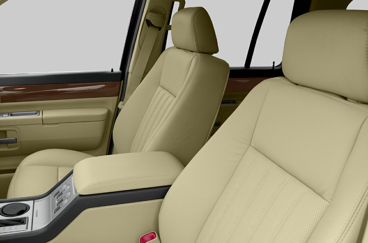 Beige leather front seats with wood trim and center console