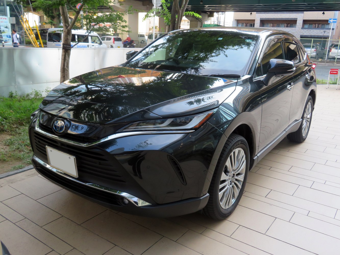 Sharp front grille and LED headlights with sleek SUV body