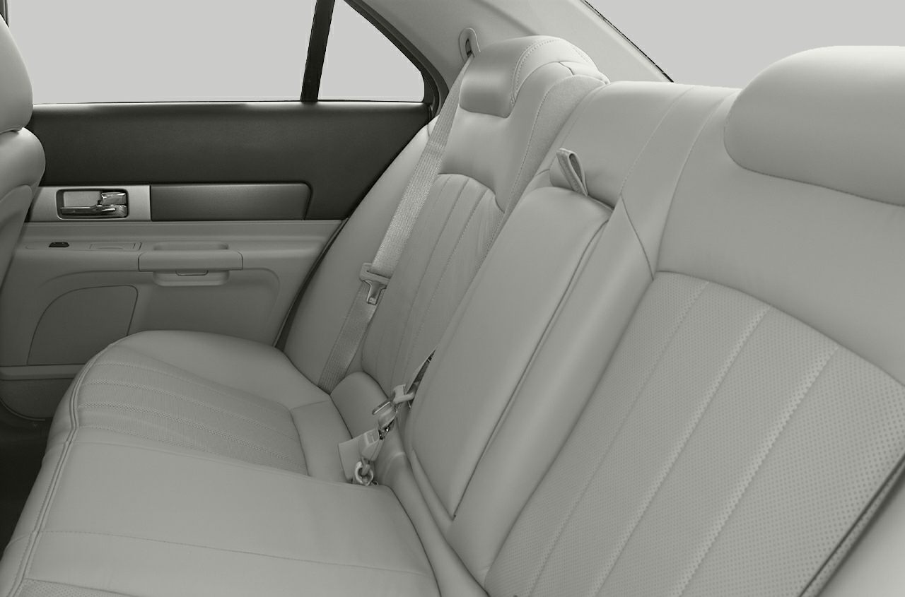 Rear leather seats with detailed stitching and seat belts