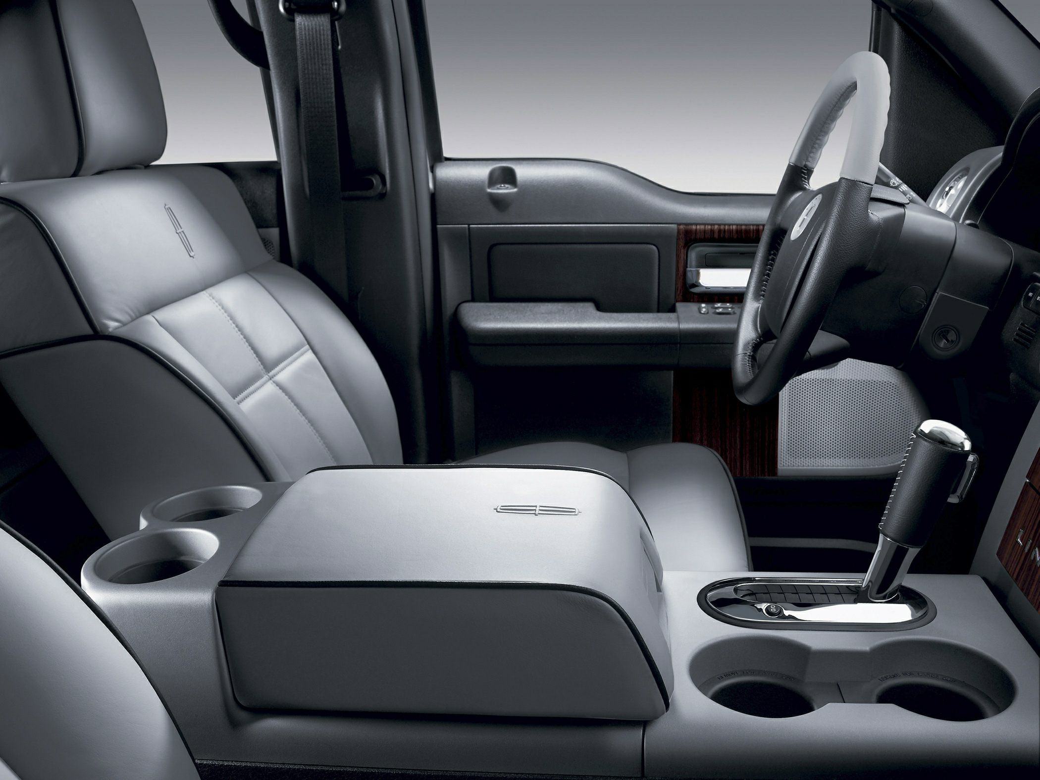 Premium leather seats and detailed center console with gear shifter and cup holders