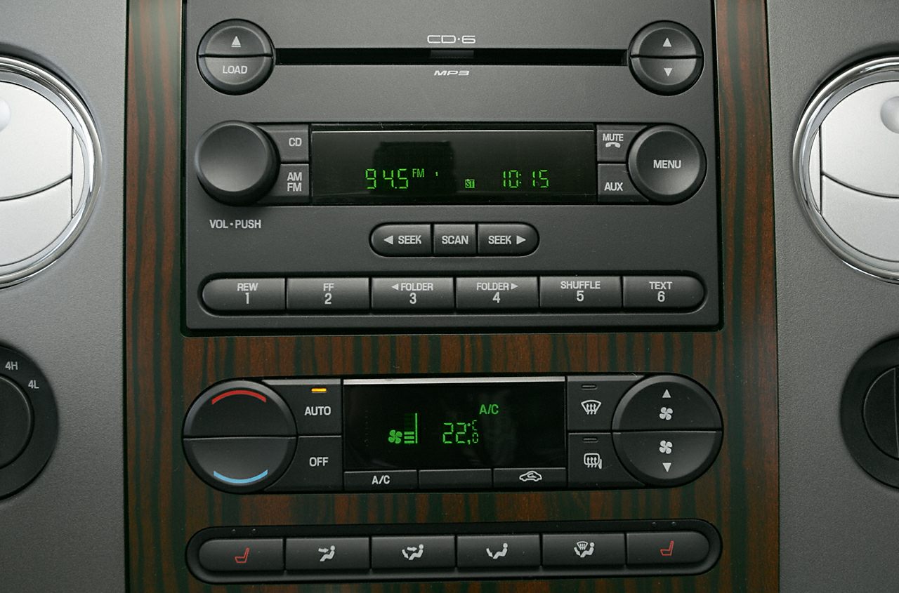 Car interior audio system and climate control with wood grain trim
