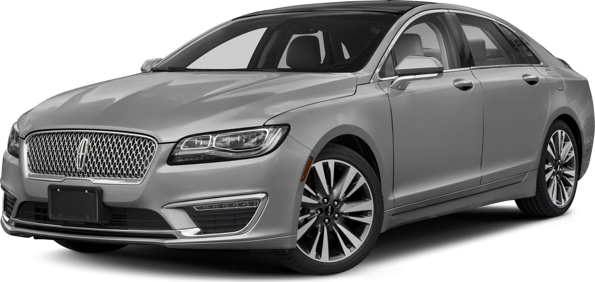Luxury sedan front grille and alloy wheels close-up