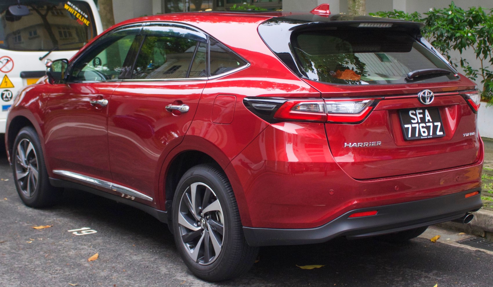 Rear and side view of modern SUV with LED tail lights and alloy wheels