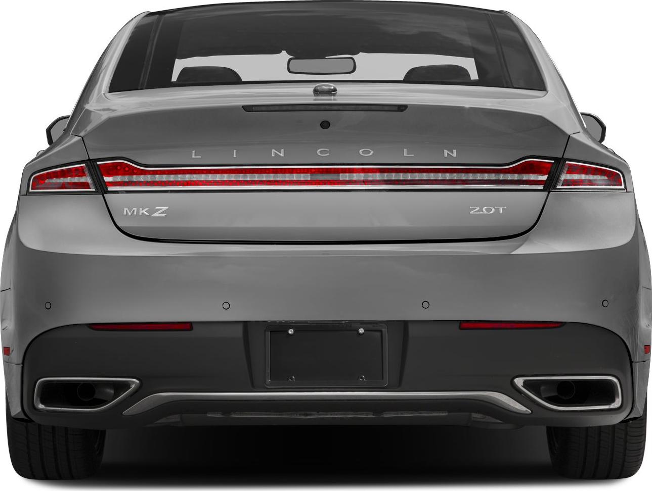 Full-width rear light bar and dual exhausts on luxury sedan rear
