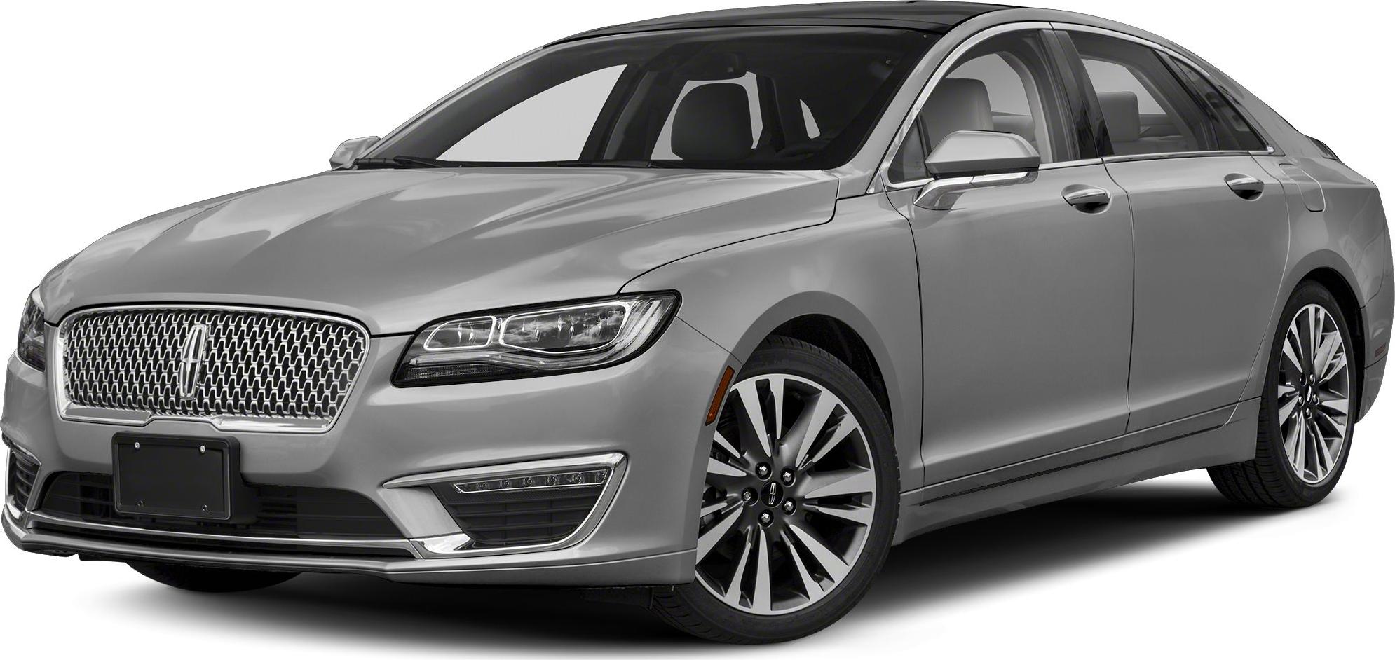 Silver mid-size sedan with chrome grille and multi-spoke alloy wheels
