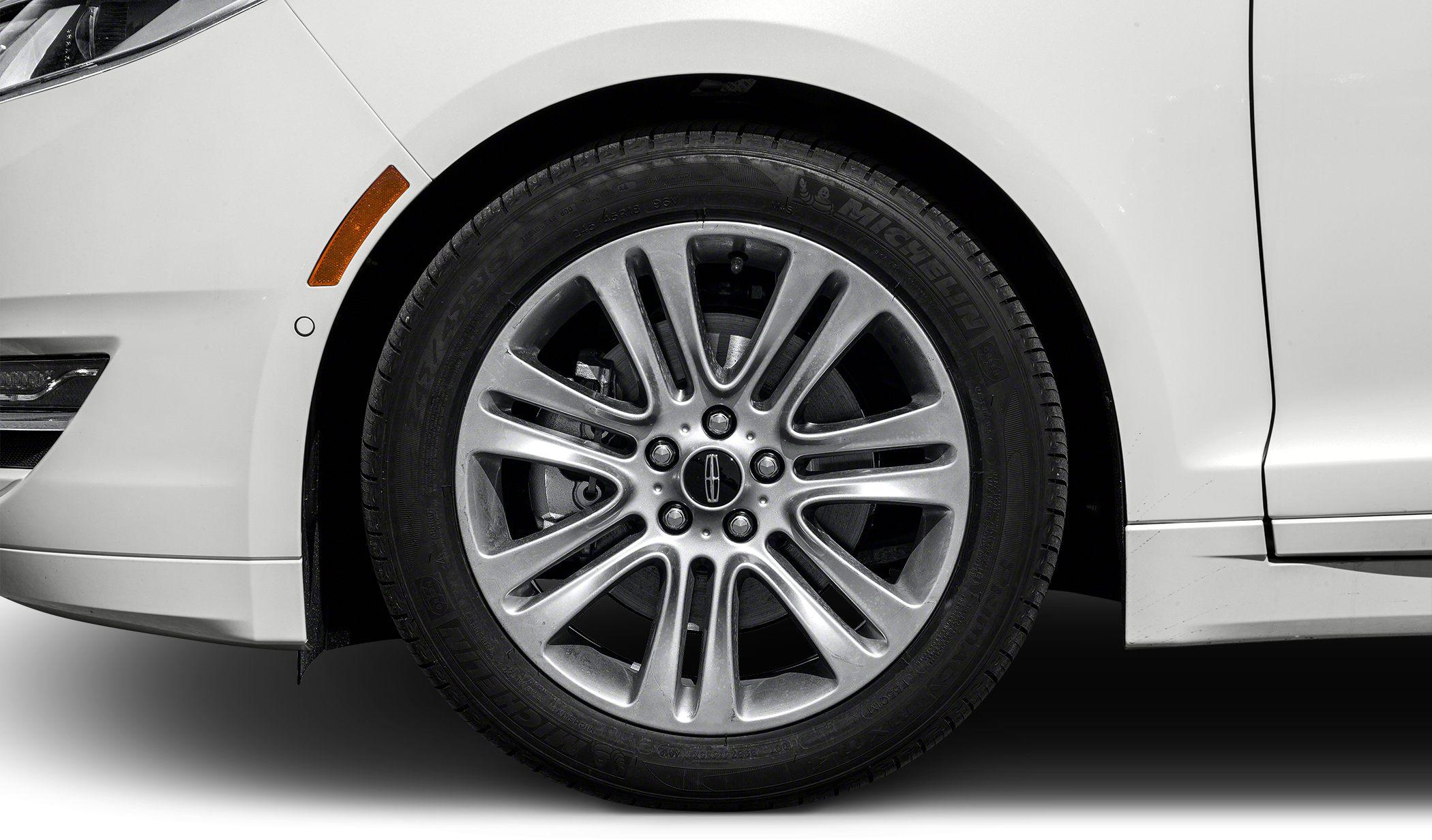 Alloy wheel and tire close-up with detailed rim design