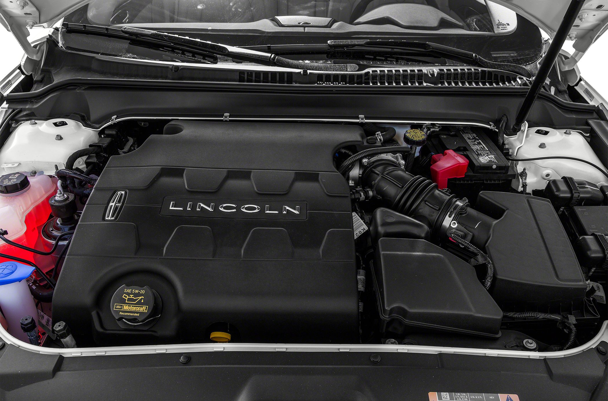 Engine compartment with Lincoln-branded engine cover and air intake system