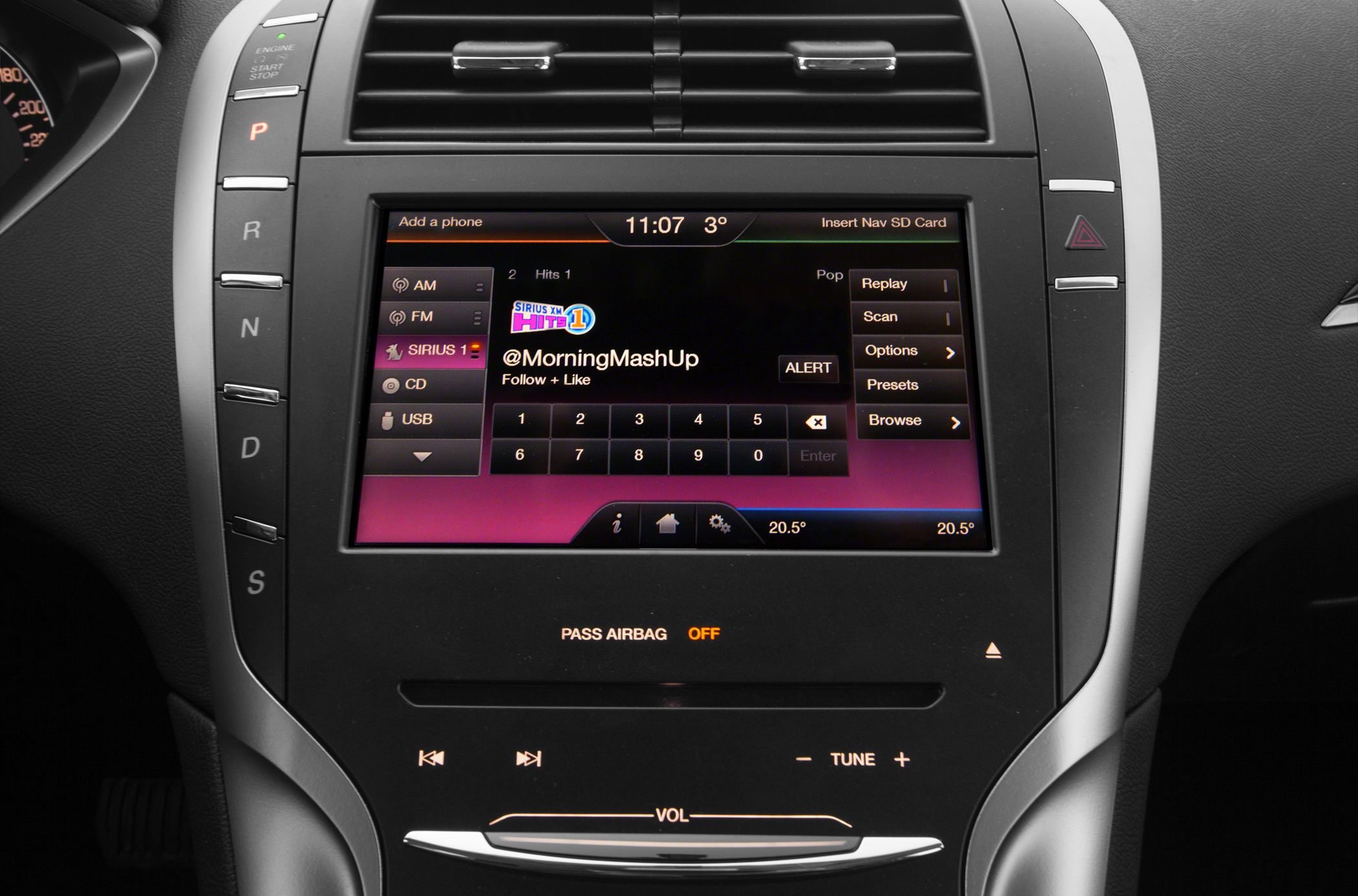 Center console touchscreen with gear selector buttons and media controls