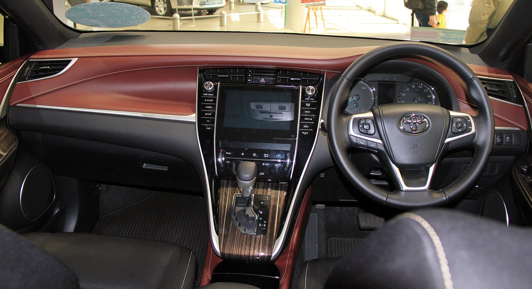 Leather steering wheel, touchscreen center console, wood trim gear shift area