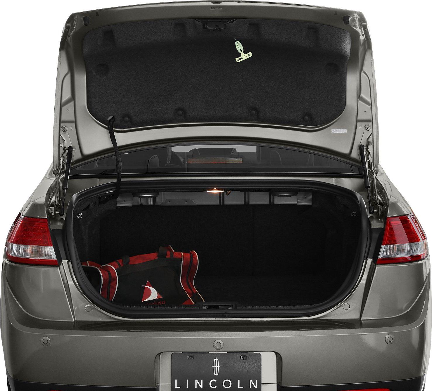 Open spacious trunk with interior lighting and a red bag