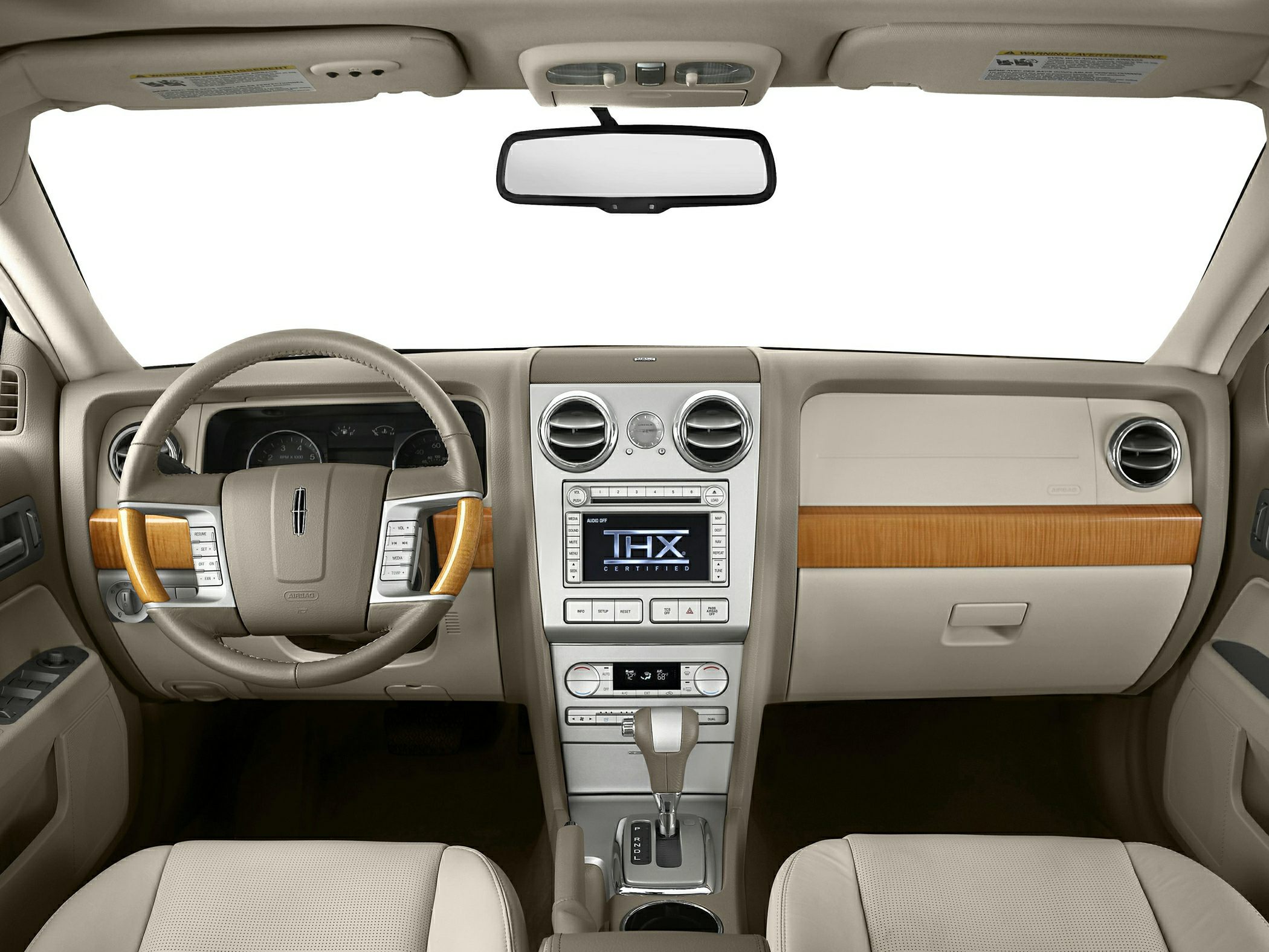 Wood-trimmed steering wheel and center console with THX-certified audio system