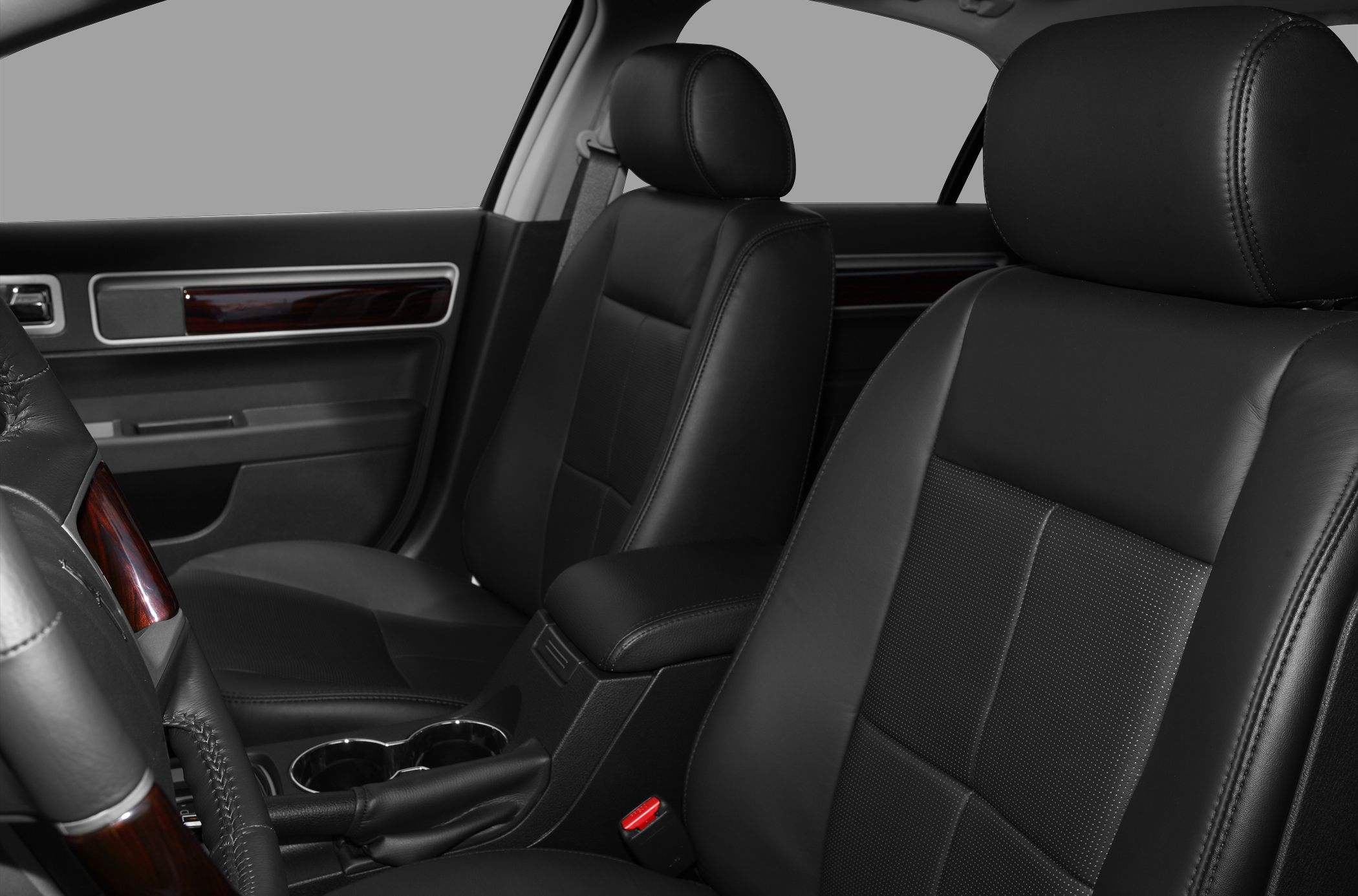 Front leather seats and cabin features with center console and wood trim