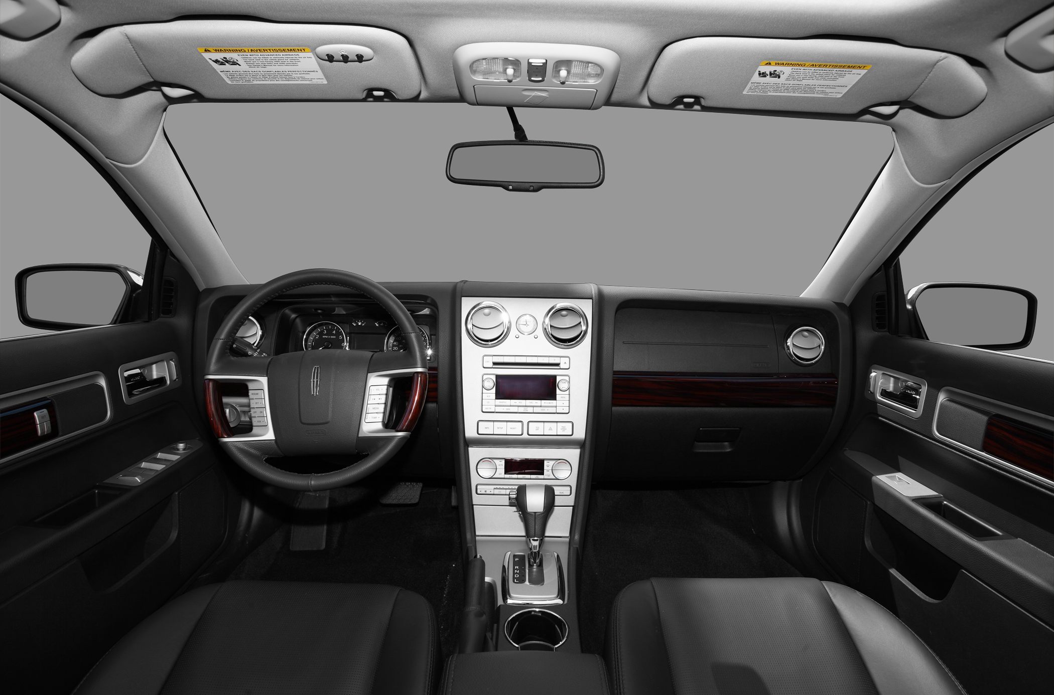 Dashboard and steering wheel with control buttons and center console with gear shifter