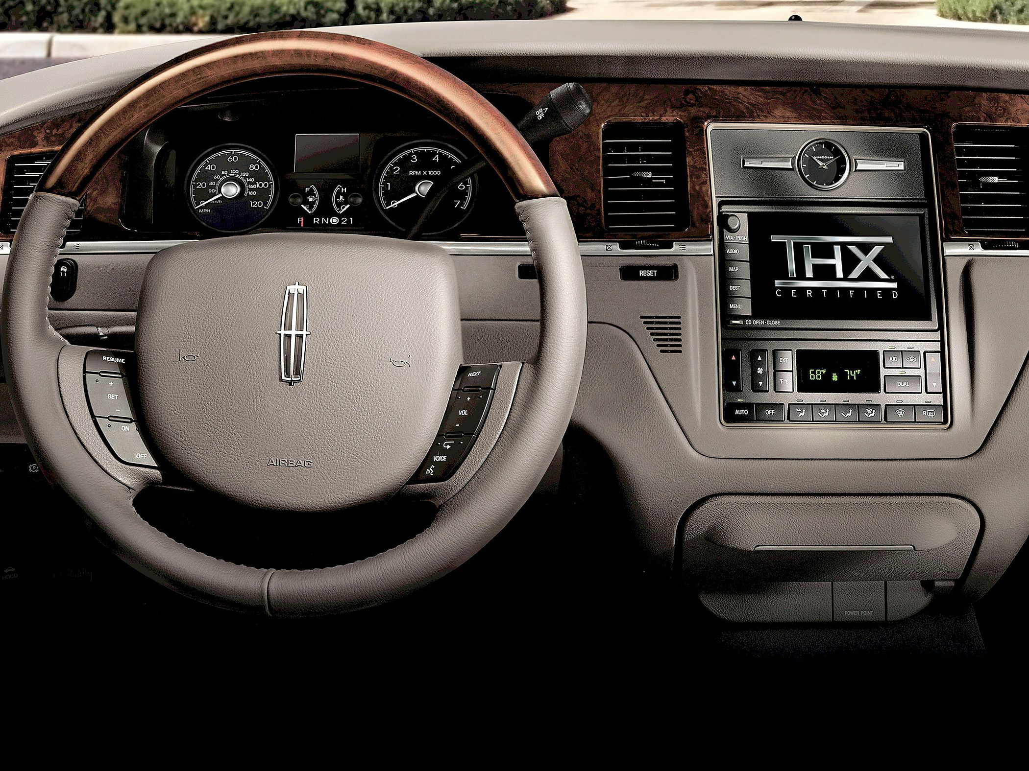 Luxury interior dashboard with wood trim and THX certified audio system