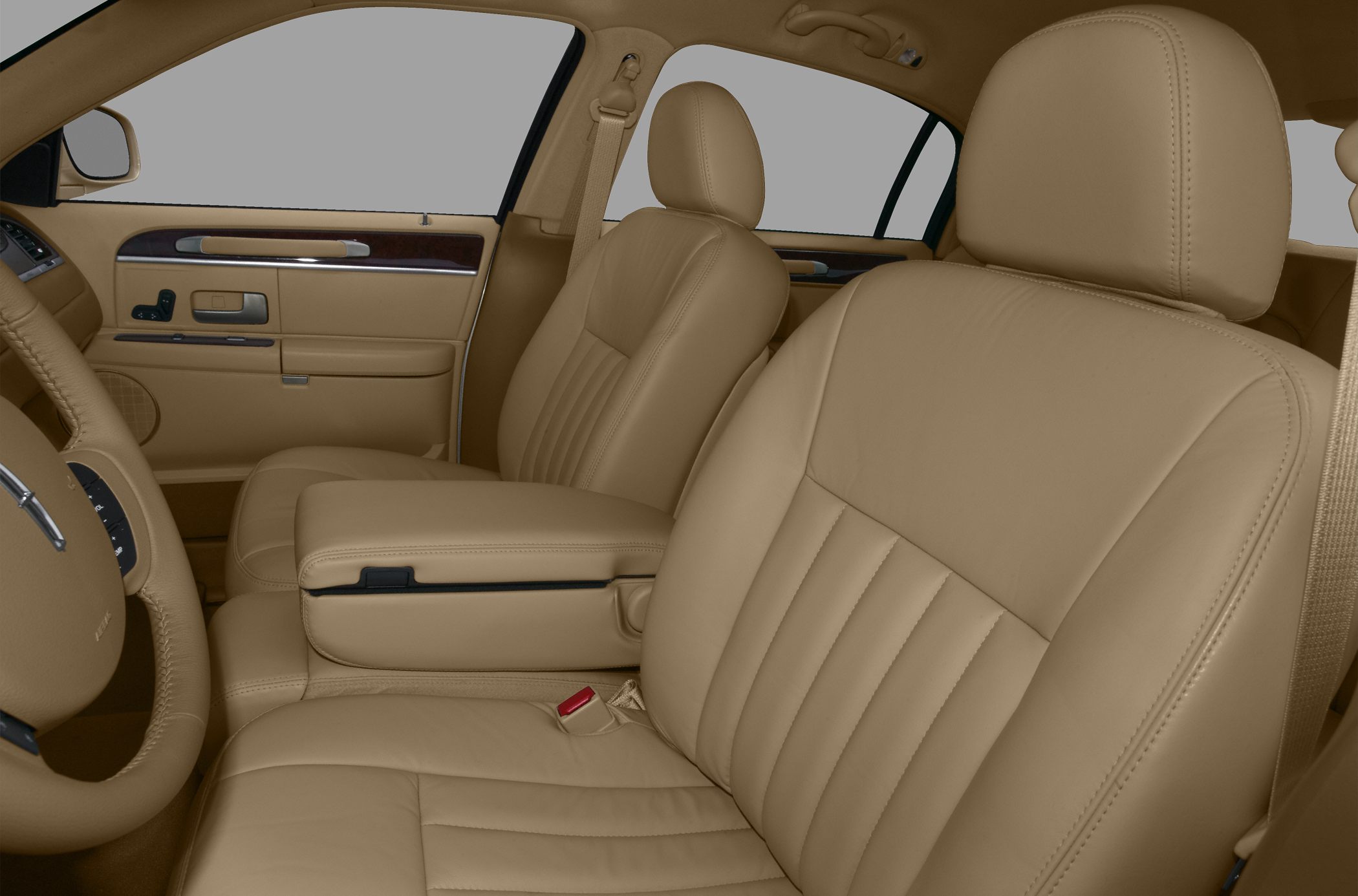 Beige leather seats with vertical stitching and wood trimmed door panel