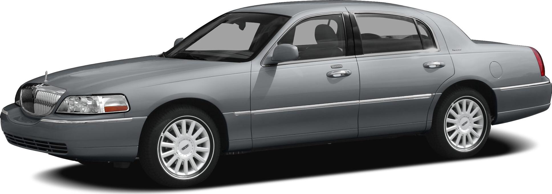 Side view of a luxury sedan with polished alloy wheels and chrome trim