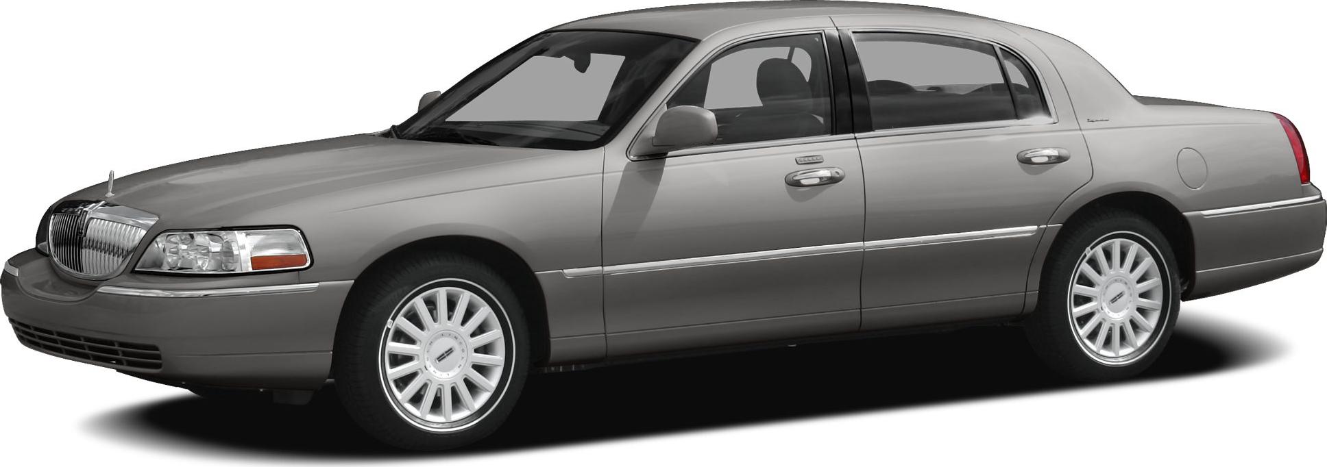 Silver luxury sedan with front grille and alloy wheels