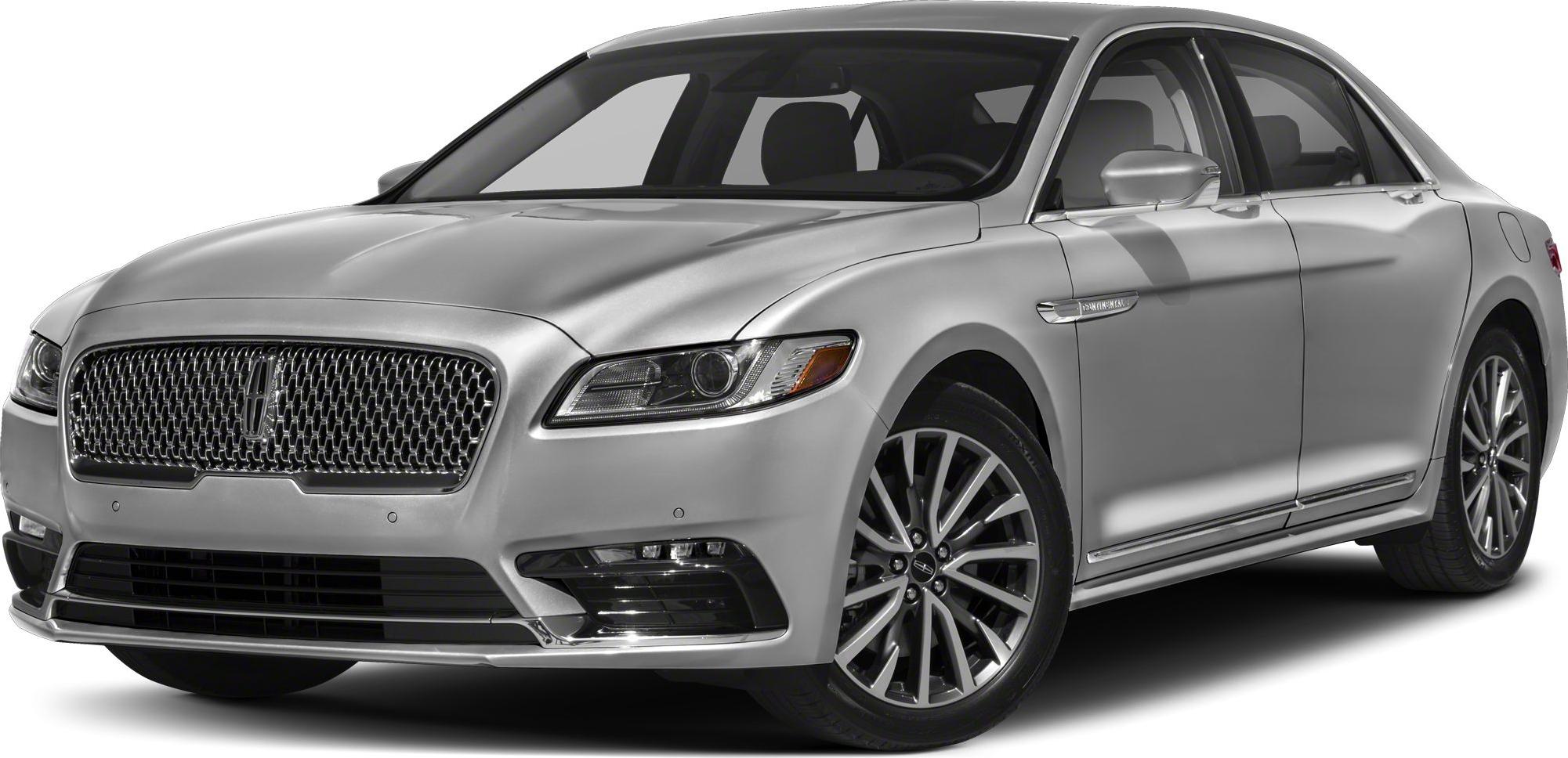 Luxury sedan front angle with distinctive grille and LED headlights