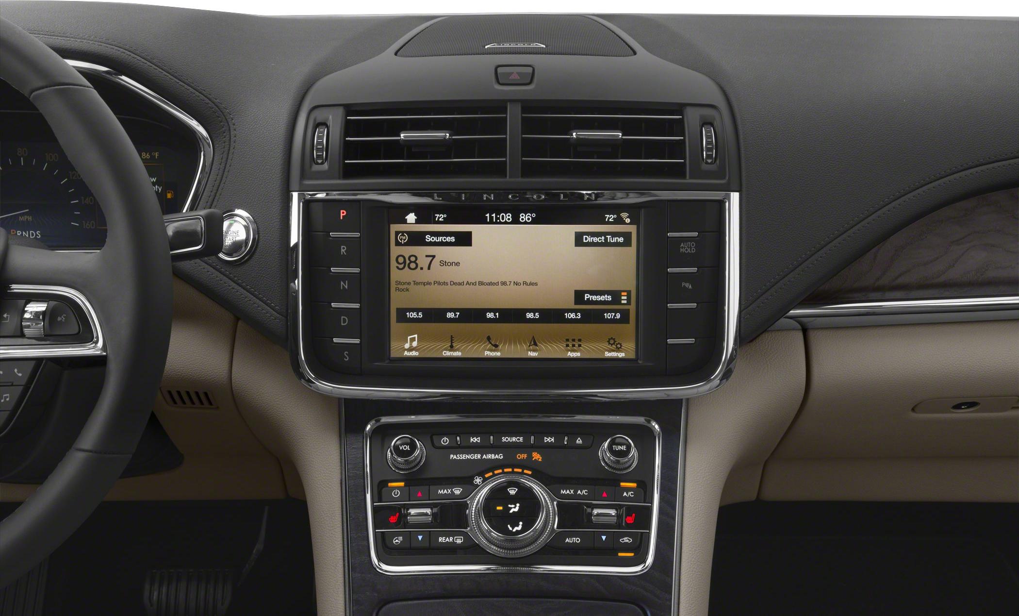Advanced infotainment screen and climate control panel with buttons and knobs